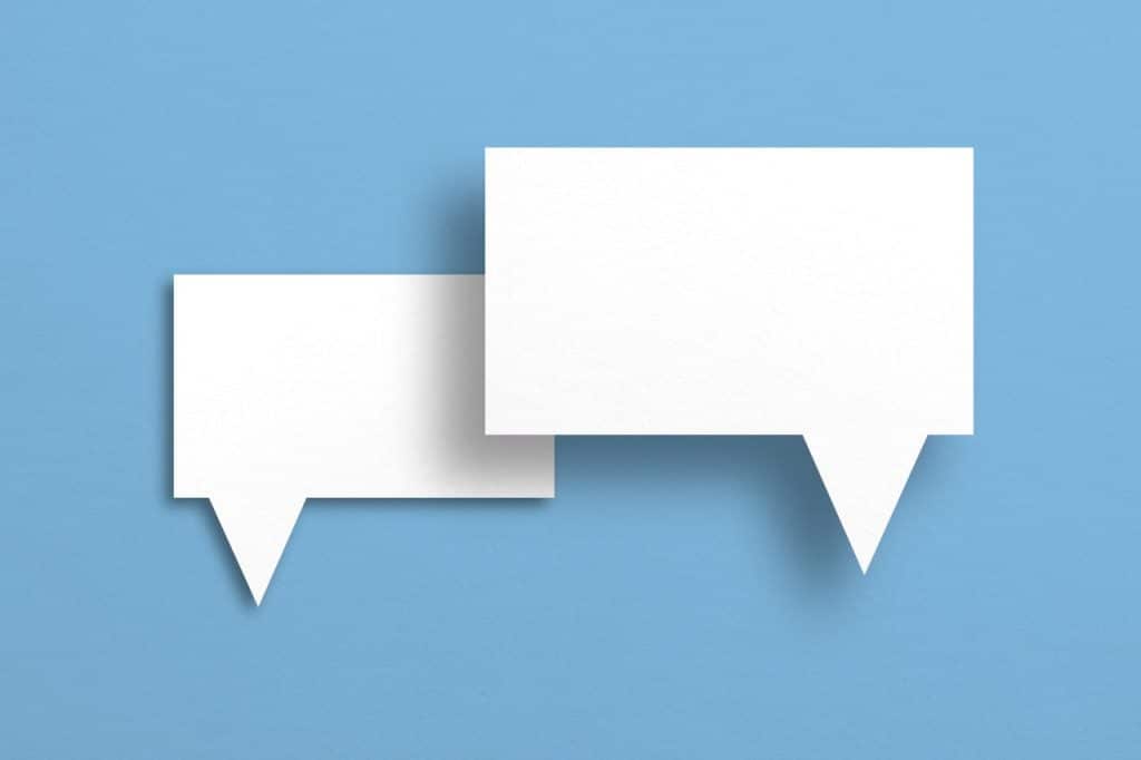 white paper with speech bubbles isolated on blue background