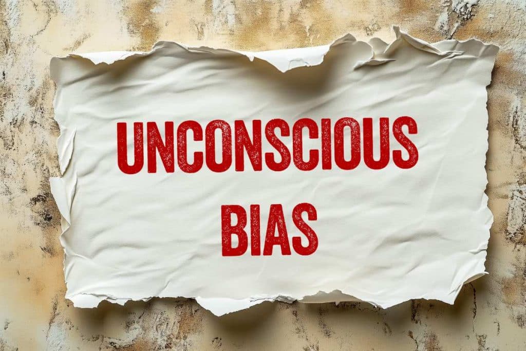 Unconscious bias message written on ripped torn paper piece