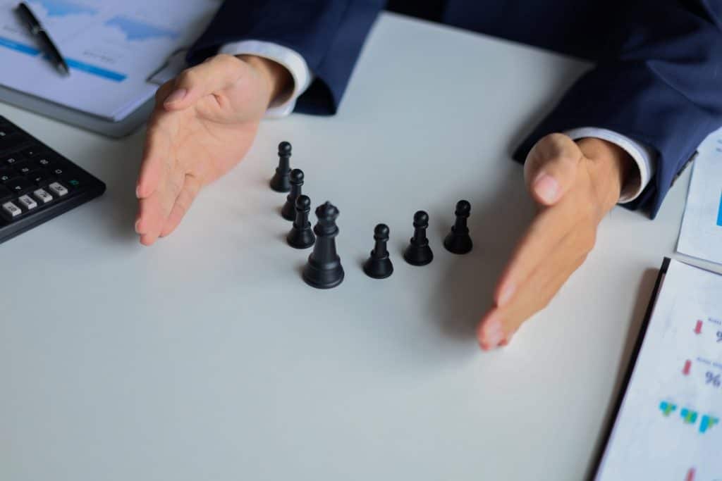 Businessman in a suit, playing chess game