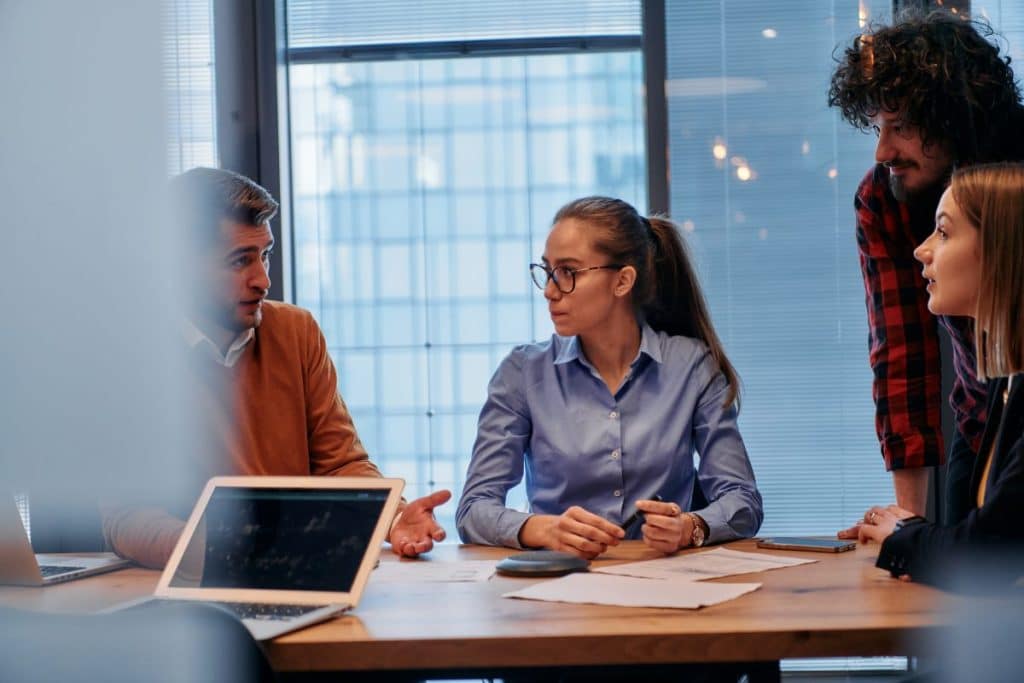 man speaking in a meeting